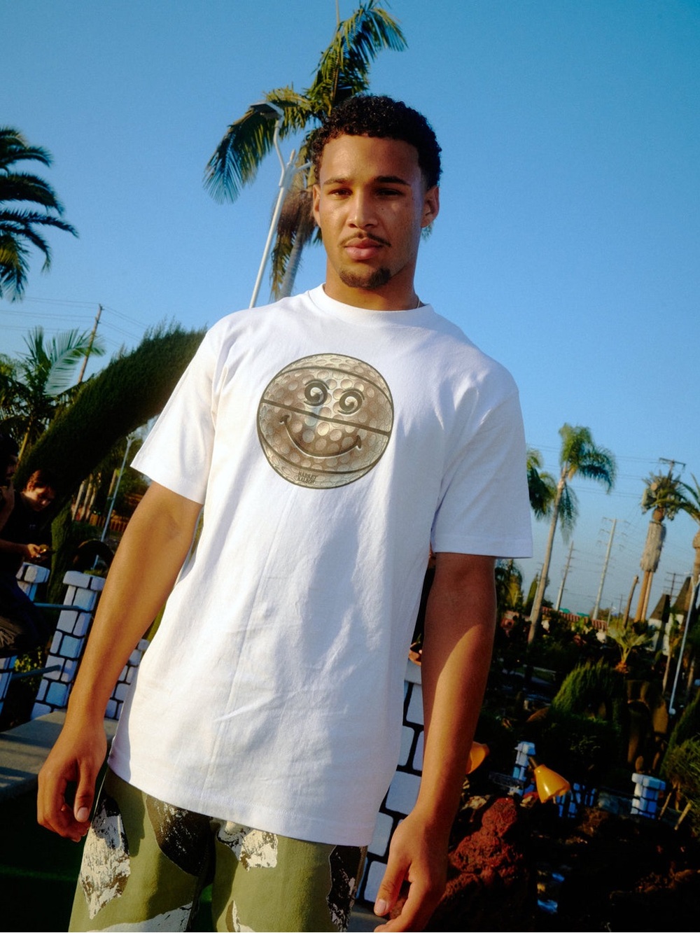 Men's White Short-Sleeve Graphic Tee with Metallic Emblem